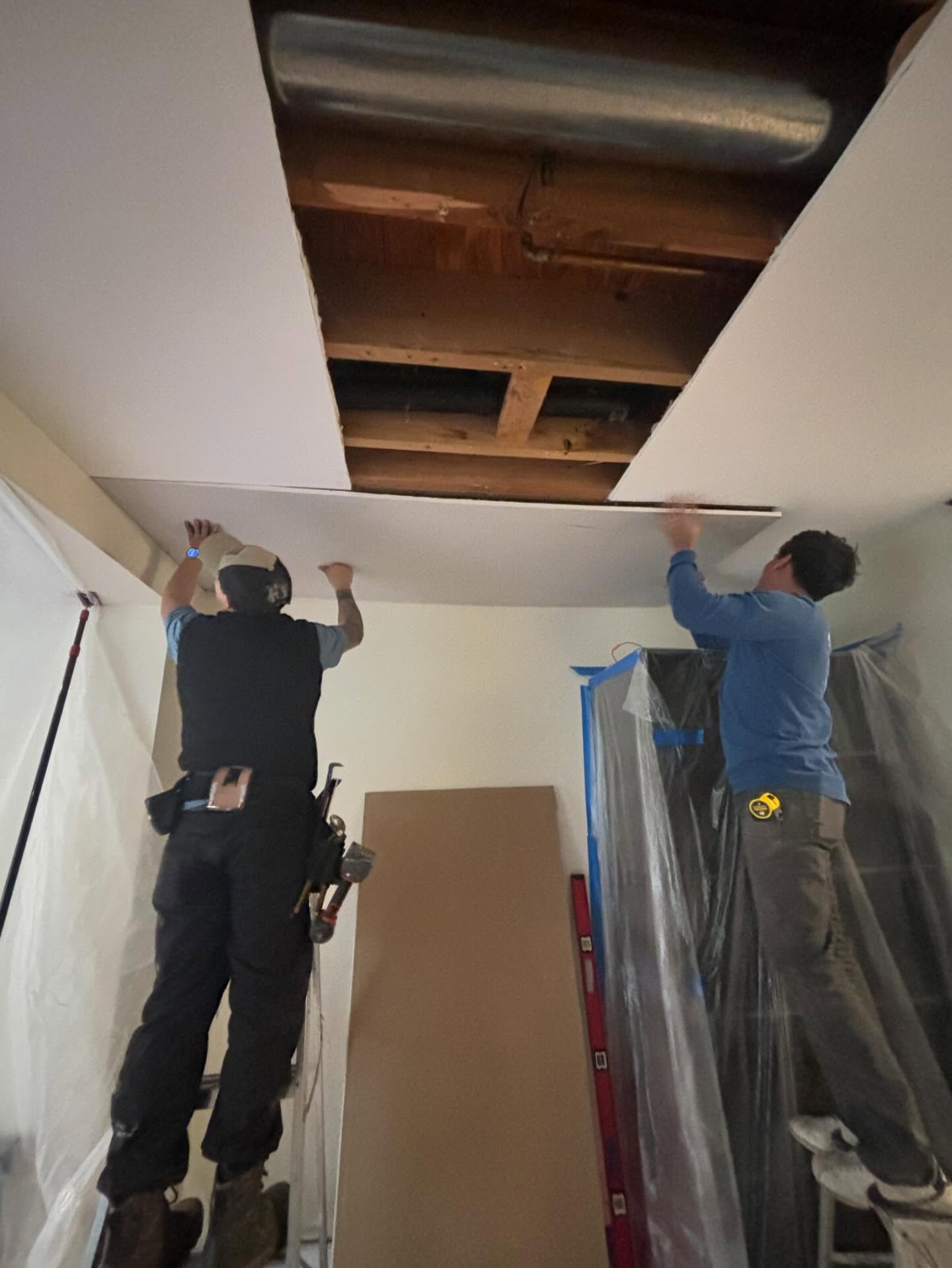 Contractors reviewing project plans outside a Pacific Northwest home