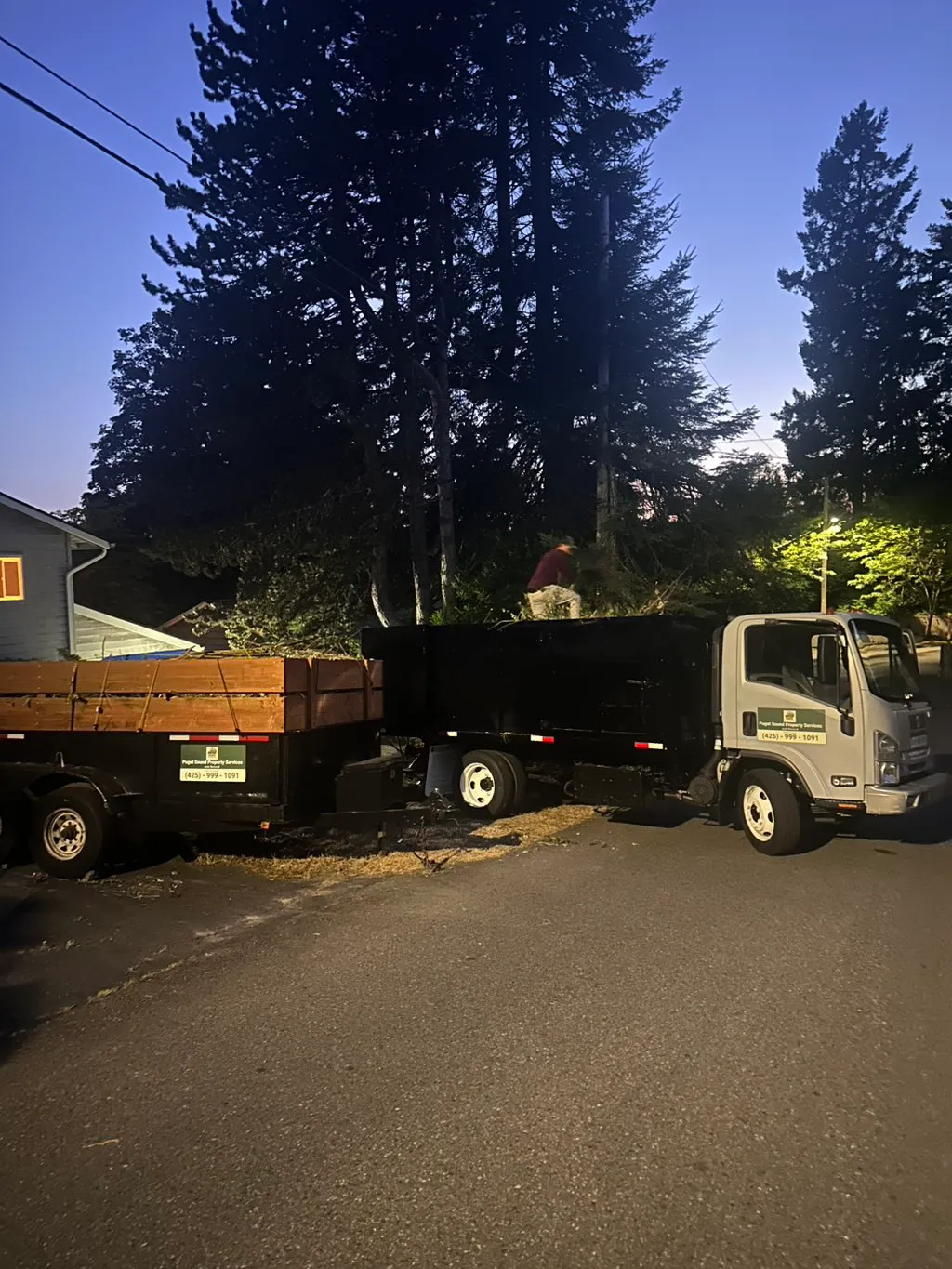 PSPS truck loaded with debris at dusk